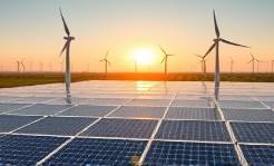 breakthrough AI innovation, focused expression, optimizing green energy solutions, photorealistic, in a solar farm with wind turbines, highly detailed, AI-controlled panels shifting, immense clarity, earthy greens and sunny yellows, natural daylight lighting, shot with a drone camera.